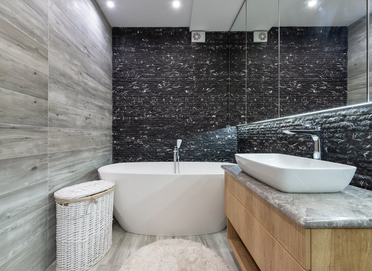 Bathroom interior with bathtub and plumbing fixtures
